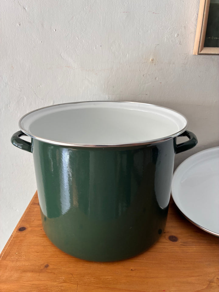 Vintage Green Enamel Bread Bin on a wooden table, showcasing rustic country cottage kitchen style.