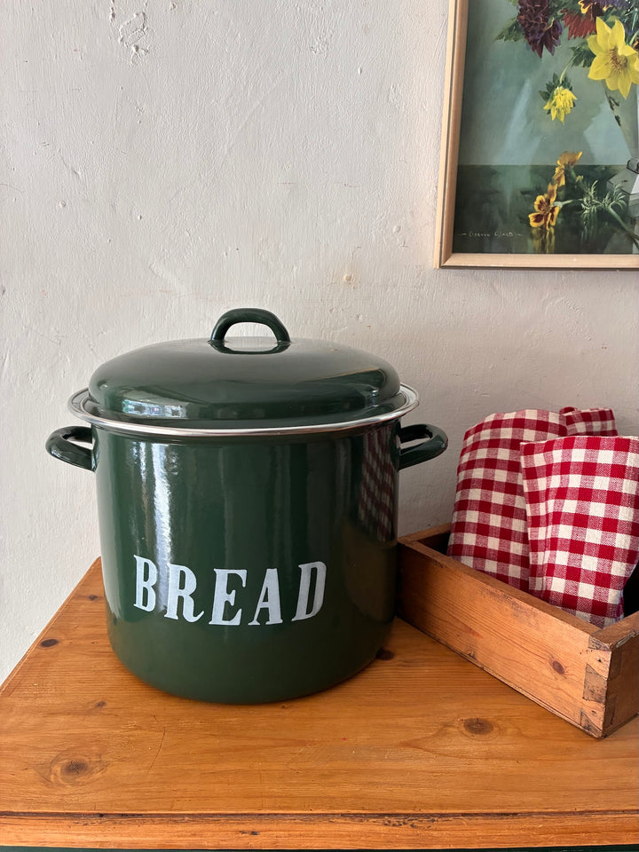Vintage Green Enamel Bread Bin on wooden table with red checked linens, perfect for rustic country cottage kitchen.