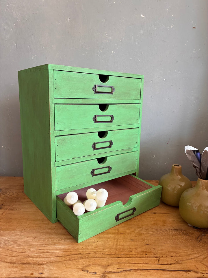 Vintage Green Mini Set of Drawers on desk with candles, showcasing vintage style and organization.