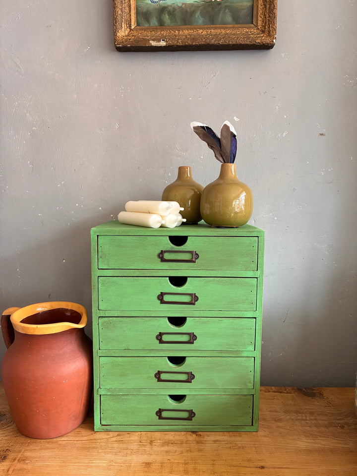 Vintage Green Mini Set of Drawers on a wooden surface with decorative items, perfect for stylish storage.