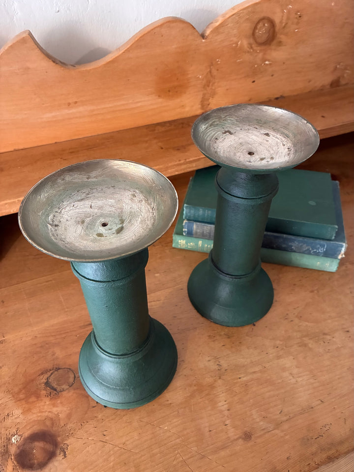 Pair of Vintage Green Metal Candlesticks on a wooden surface with books, showcasing vintage home decor elegance.