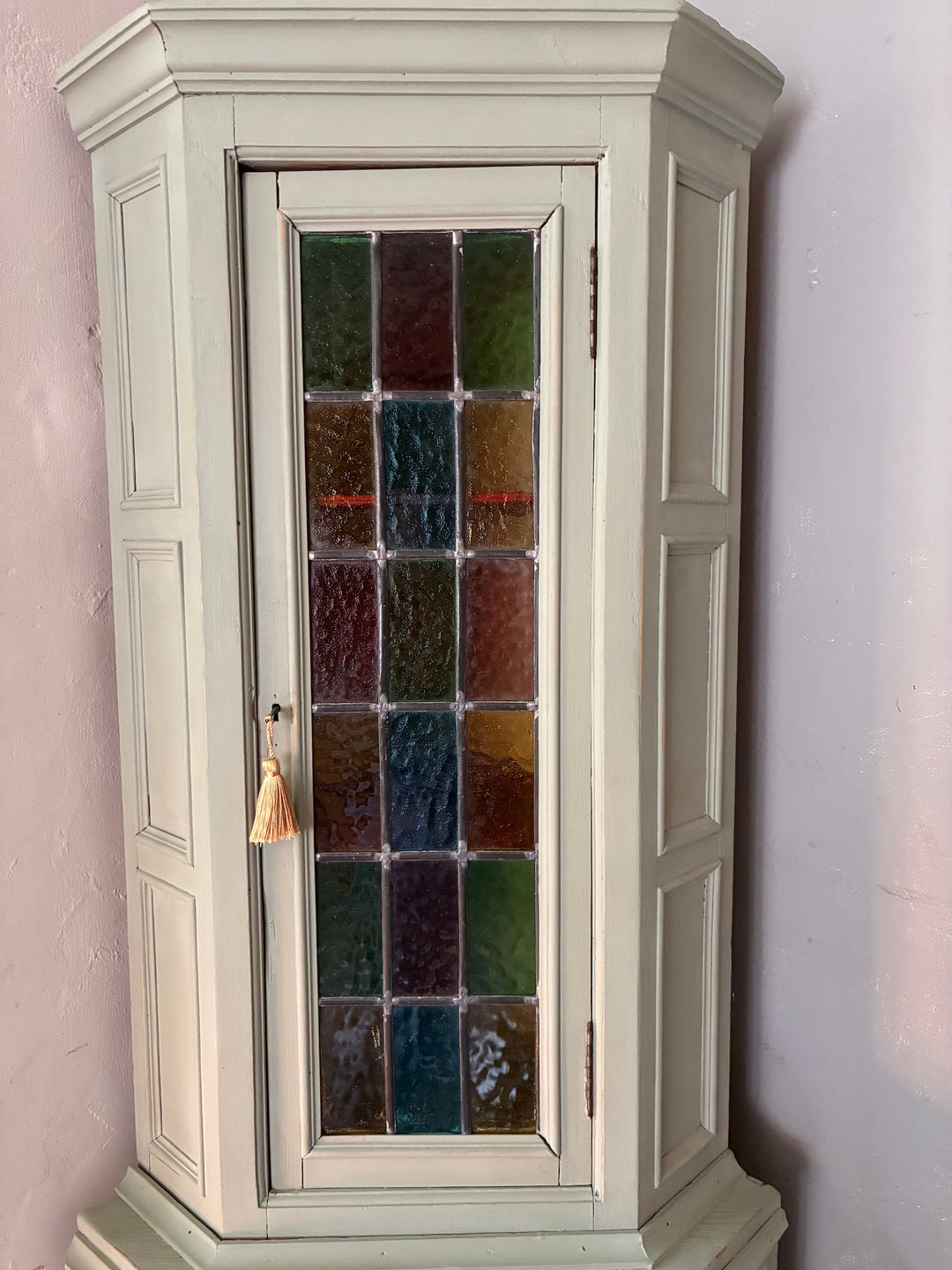 Green Painted Corner Cupboard with Stained Glass Panel showcasing vintage charm and cottage core appeal.