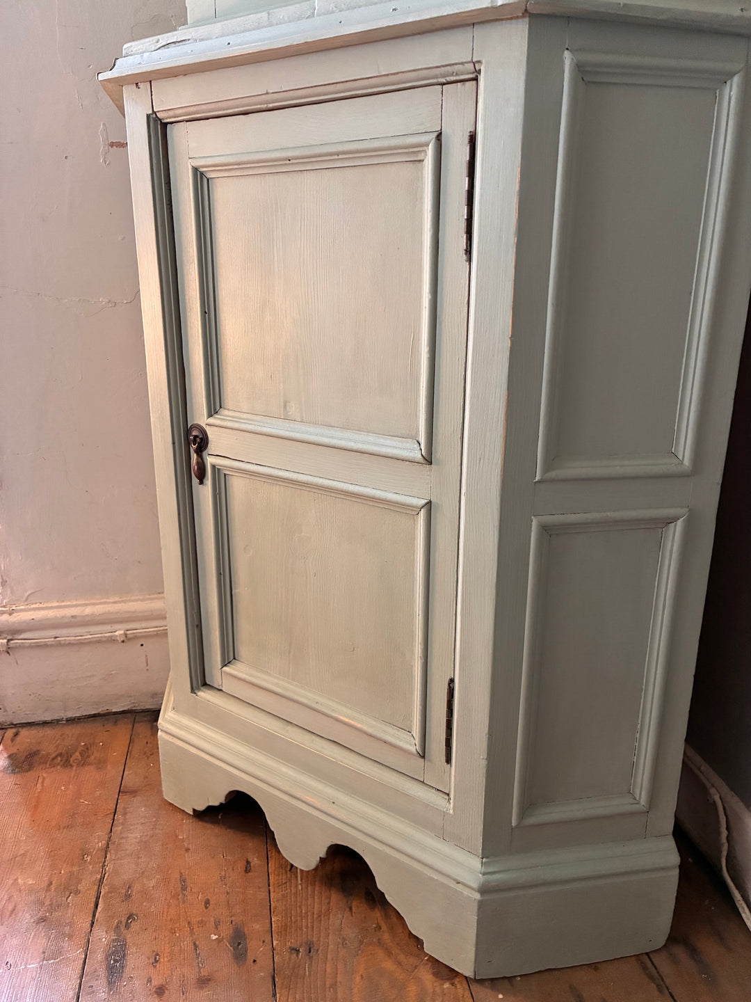 Green Painted Corner Cupboard with Stained Glass Panel in a vintage home setting, showcasing hand-built design and distressed finish.