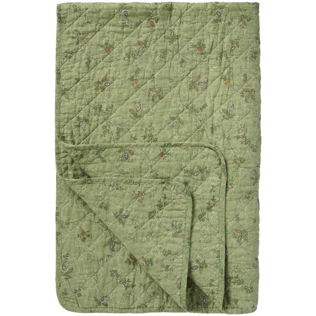 Soft Green Quilted Throw featuring a floral paisley pattern, perfect for cozying up in a country cottage setting.