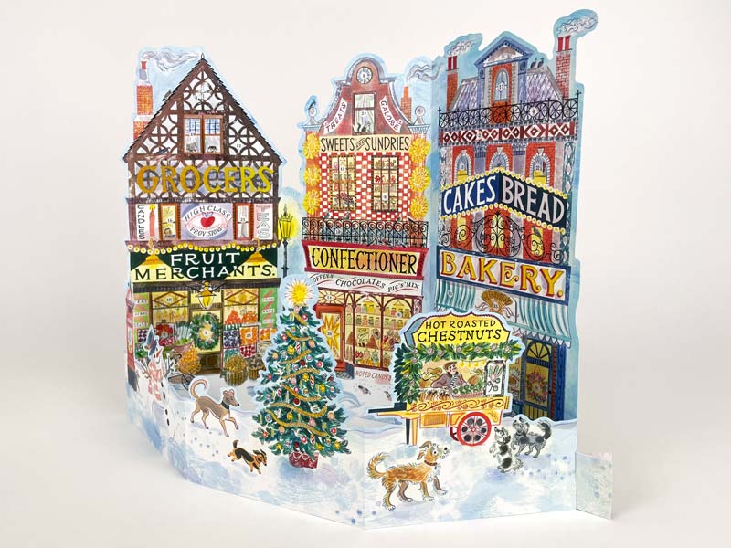 Christmas advent calendar featuring three old fashioned shops in a festive scene at Source for the Goose, Devon
