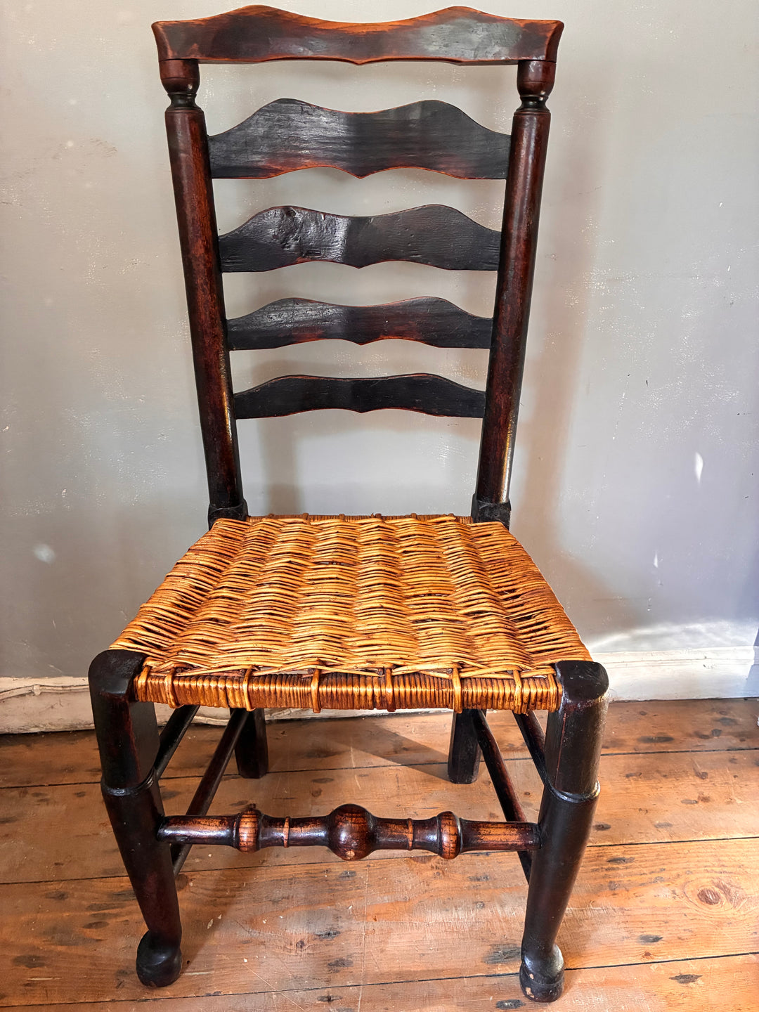 Antique Ladderback Chair - Lancashire with hand-woven rush seat and distinctive curved slats.