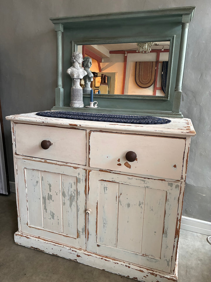 Large Duck Egg Blue Wall Mirror above a vintage white cabinet with distressed finish and decorative columns.