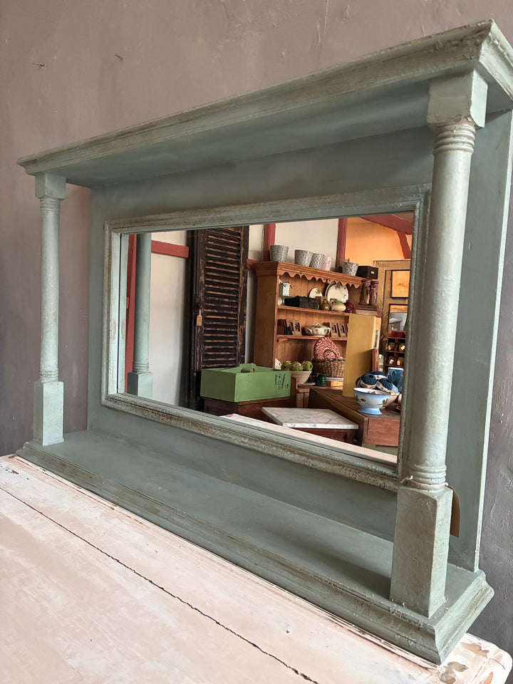 Large Duck Egg Blue Wall Mirror with decorative columns and dual shelves for displaying collectibles.