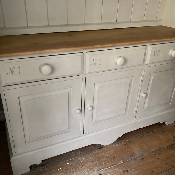 three cupboards and drawers on dresser painted in Annie Sloan Country Grey