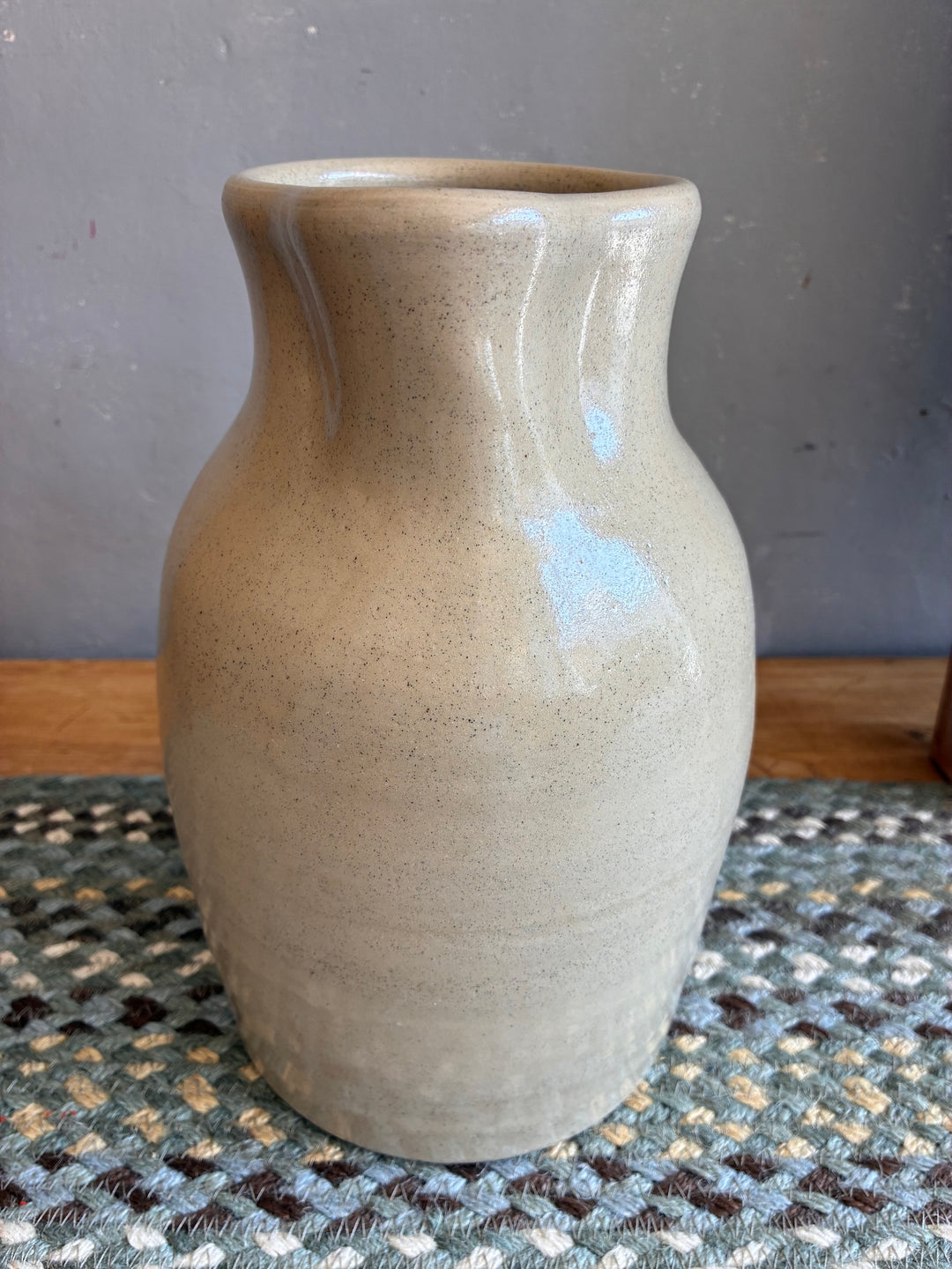 Large Stoneware Studio Pottery Jug in soft putty glaze, showcasing elegant design and unique spout.