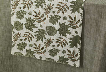 Autumn Leaf Table Runner with decorative beading on a green tablecloth, perfect for cosy dinners and festive gatherings from Source for the Goose Devon.