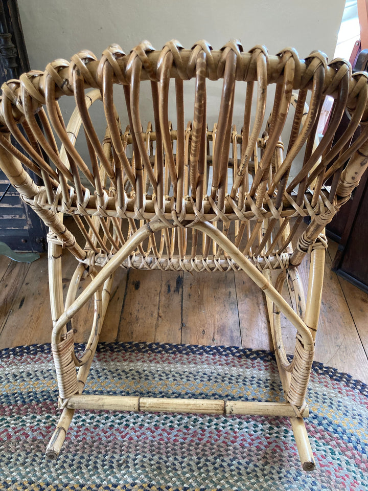 intricately woven cane rocking chair