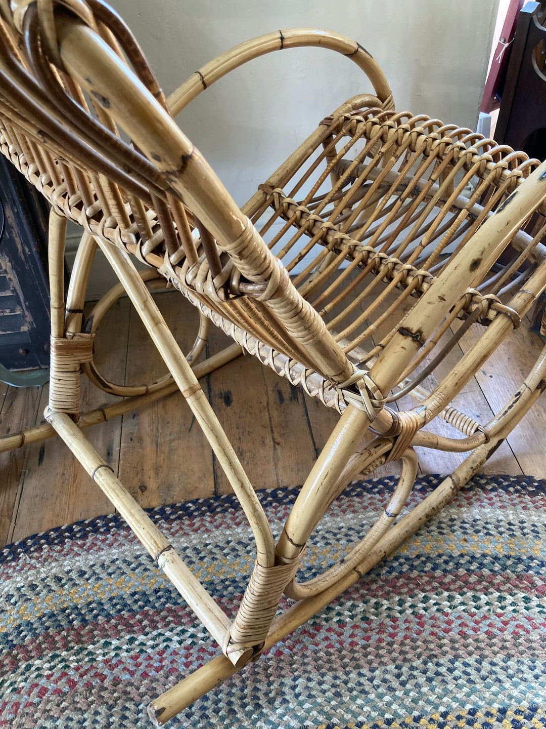 side view of curvaceous wicker rocking chair