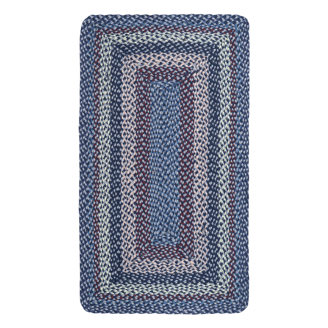Lupin Blue Rectangle Organic Jute Braided Rug in lilac, blue, and aubergine tones for a charming interior accent.