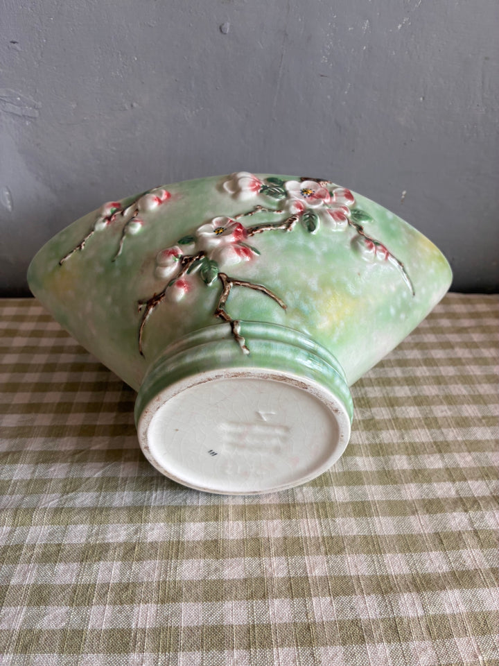 Vintage Sylvac Apple Blossom Vase featuring three-dimensional blossoms on a soft green background.