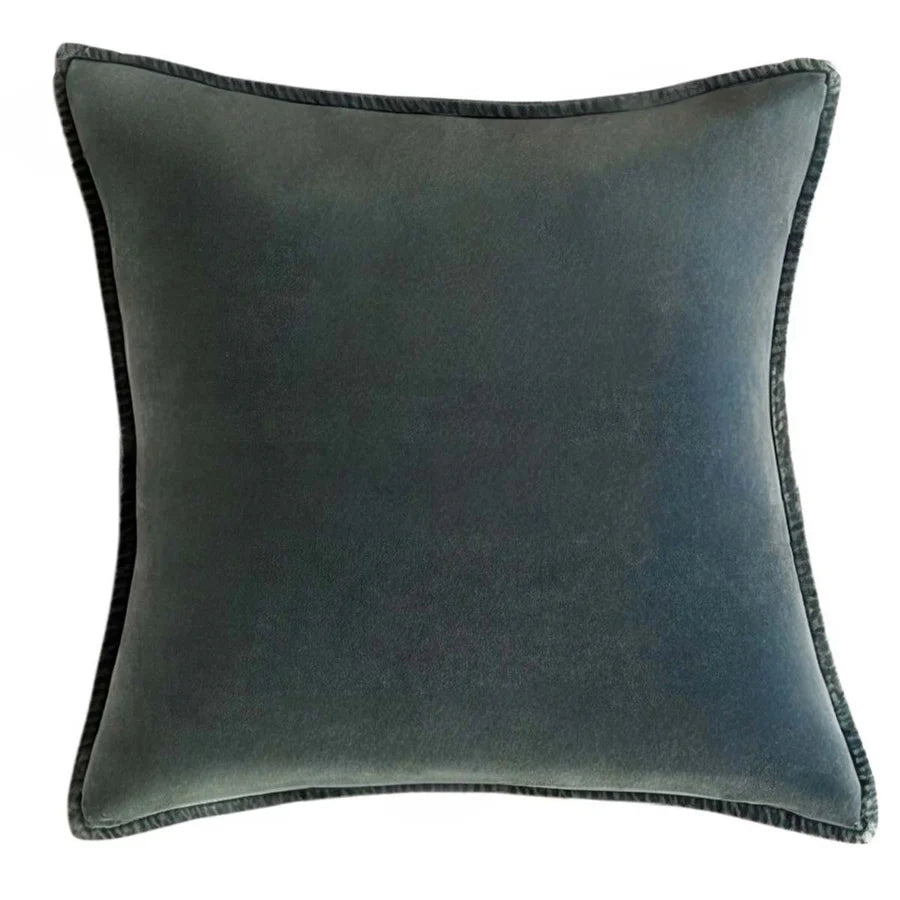 Stonewashed velvet cushion in deep green with matching trim from Source for the Goose, Devon.
