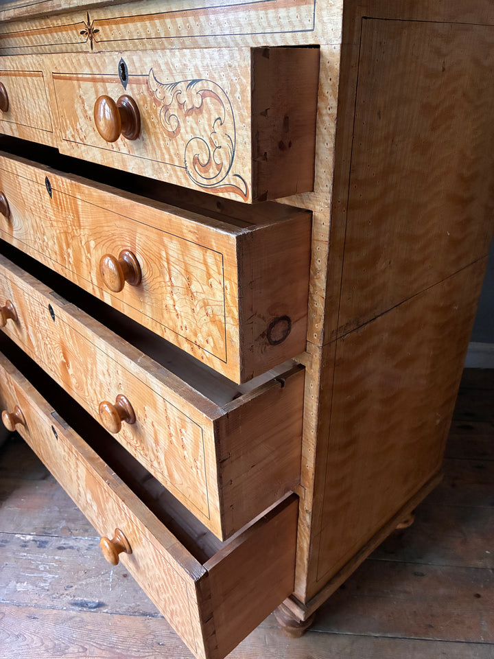 19th Century Scumbled Pine Chest of Drawers with detailed faux wood grain and wooden knobs.