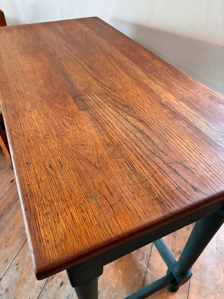 Vintage Painted Desk - Amsterdam Green with a rich wood top and distinctive green legs, showcasing vintage furniture elegance.