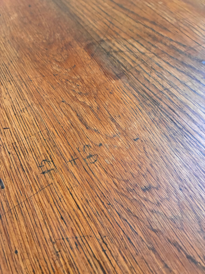 Vintage Painted Desk - Amsterdam Green table surface showcasing rich wood grains and vintage markings.