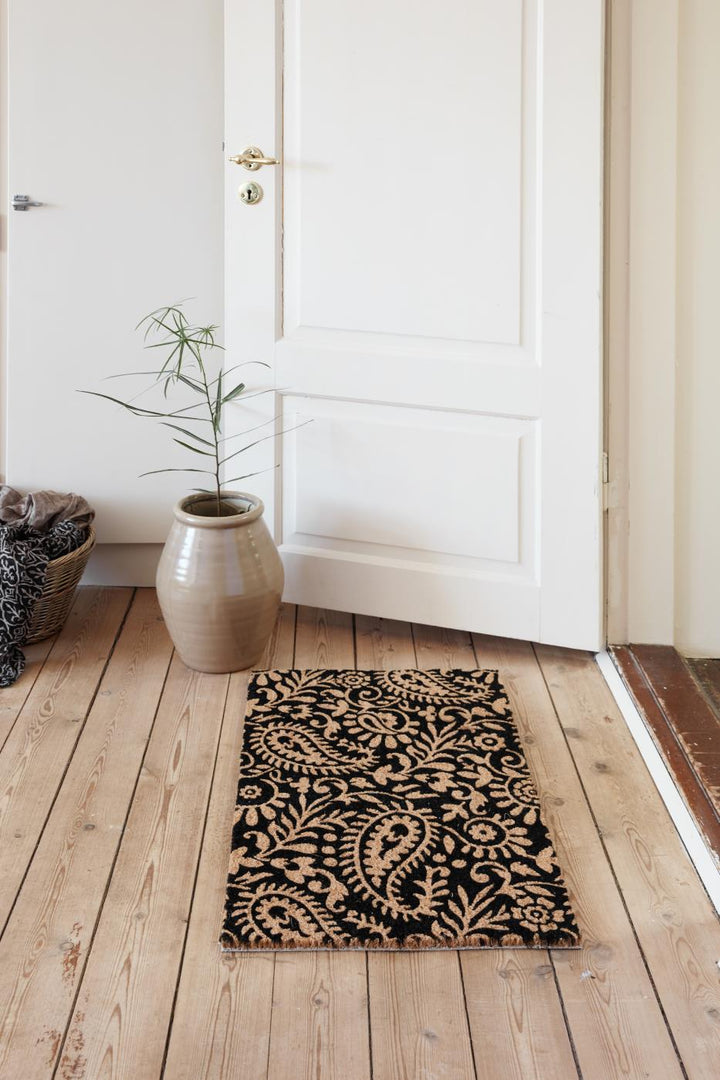 Paisley Jute Doormat on natural wood floor