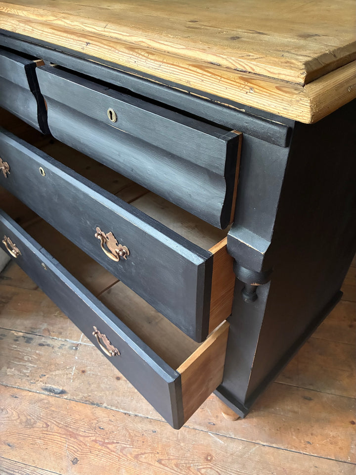Rustic Pine Chest of Drawers - Ebonised Paint features intricate drawers and brass drop handles.