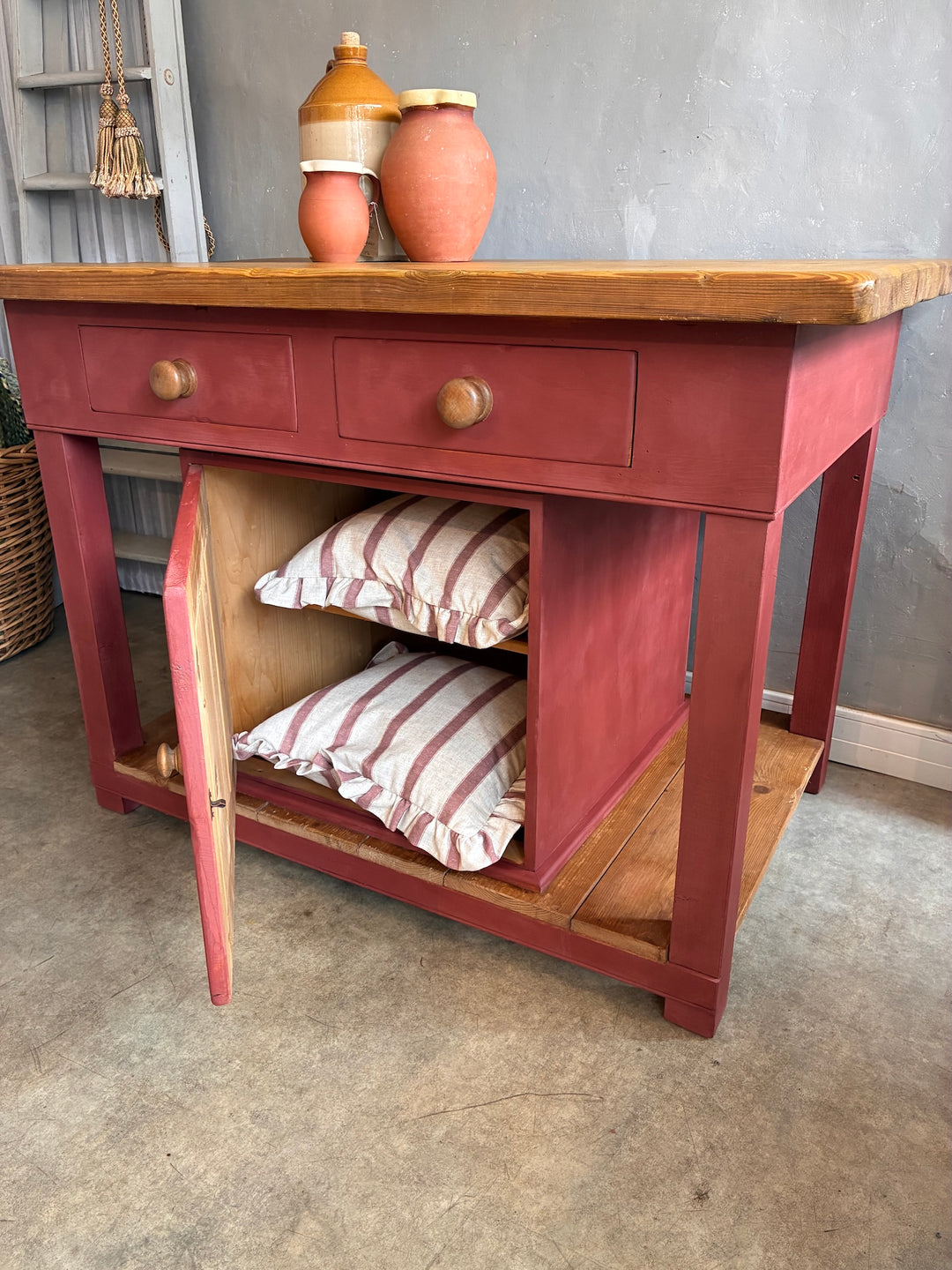 Pine Kitchen Island with Painted Base featuring a butcher's block top and storage drawers, perfect for a rustic kitchen.