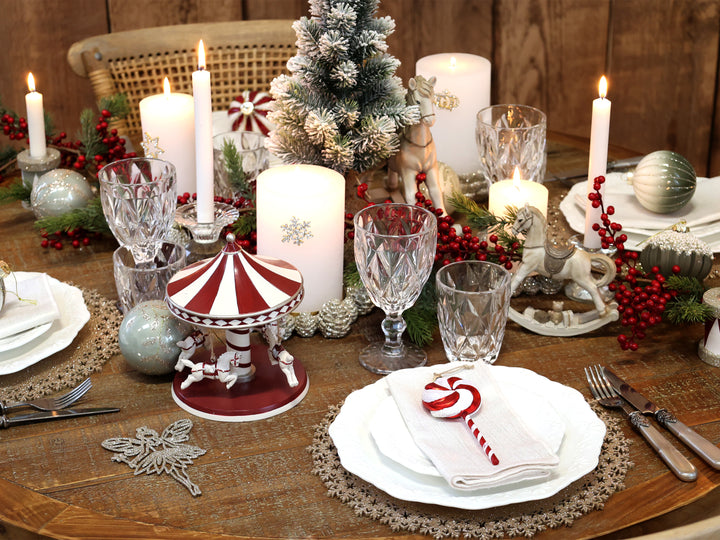 table display incorporating red and white Christmas carousel