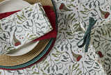 Festive Robin & Mistletoe Napkins on dining table, 100% cotton, by Source for the Goose Devon, adds Christmas charm and warmth.