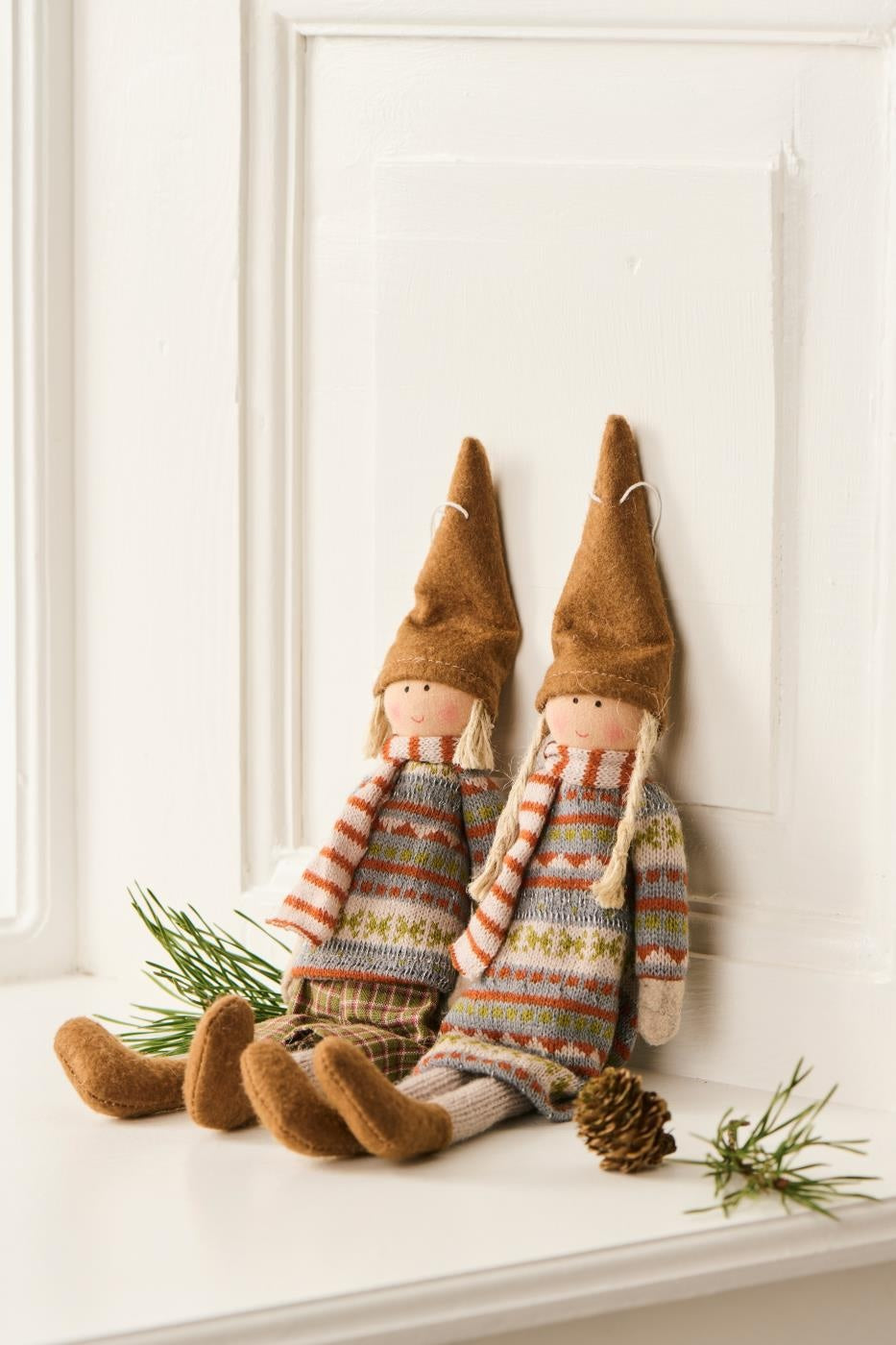 Rustic hanging dolls Sophie and Siggy, in knitted jumpers, add vintage charm for autumn and winter decor - Source for the Goose Devon.