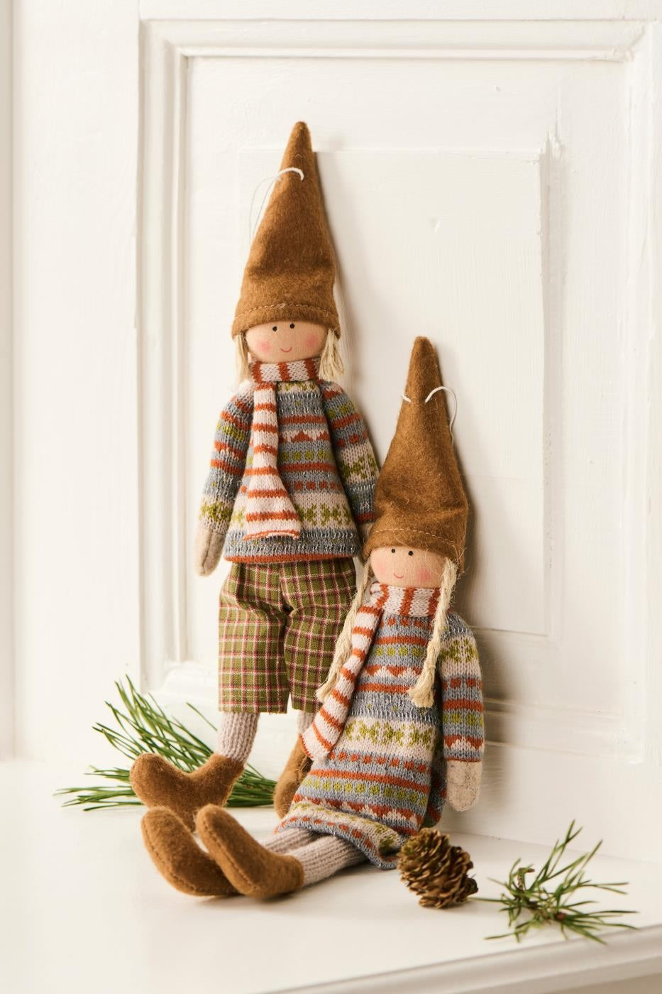 Rustic hanging dolls Sophie and Siggy in knitted outfits from Source for the Goose, Devon, perfect for autumn decor.