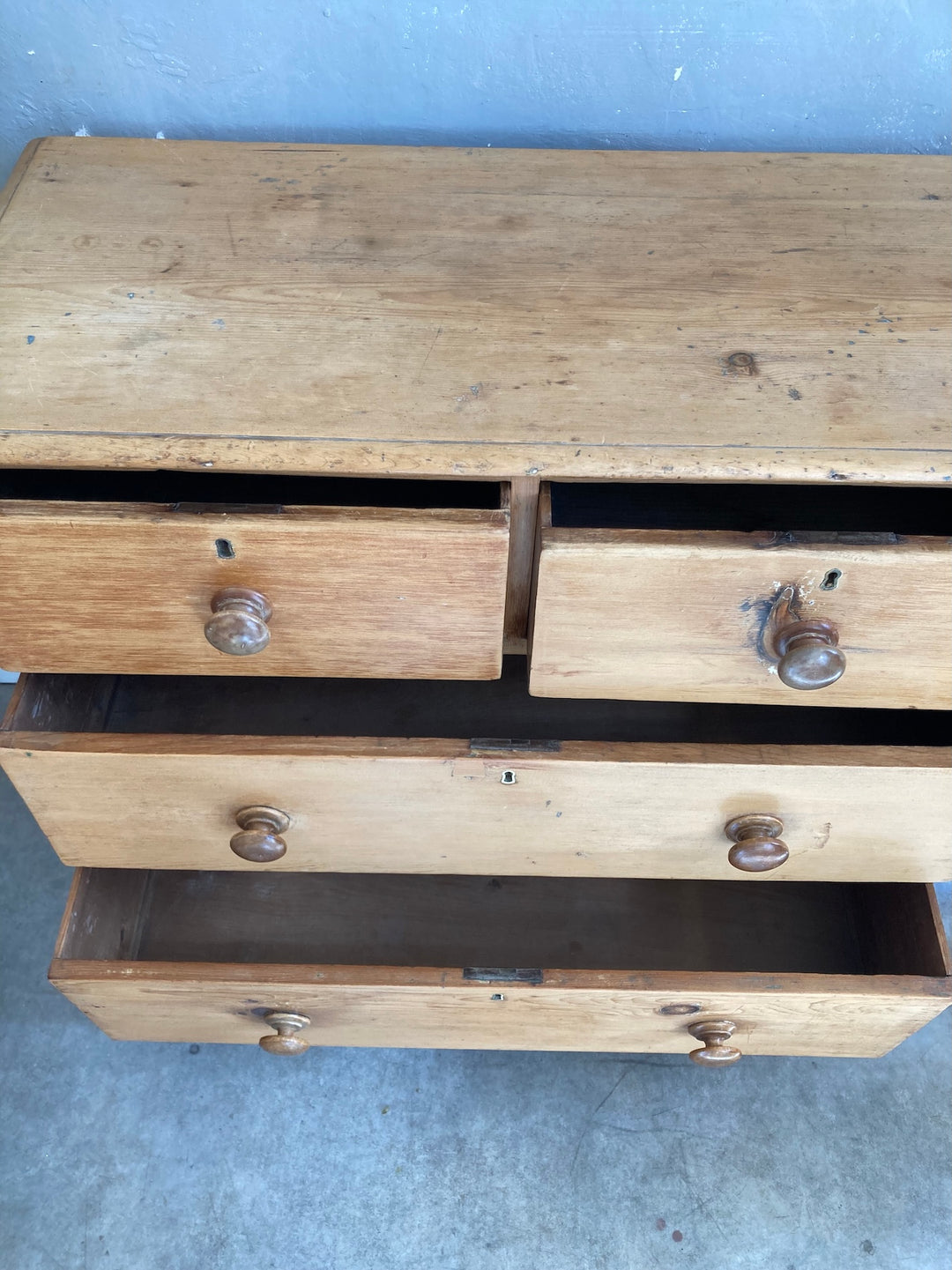 Rustic Victorian Pine Chest of Drawers featuring two over two drawers with original elm knobs, from Source for the Goose, Devon.