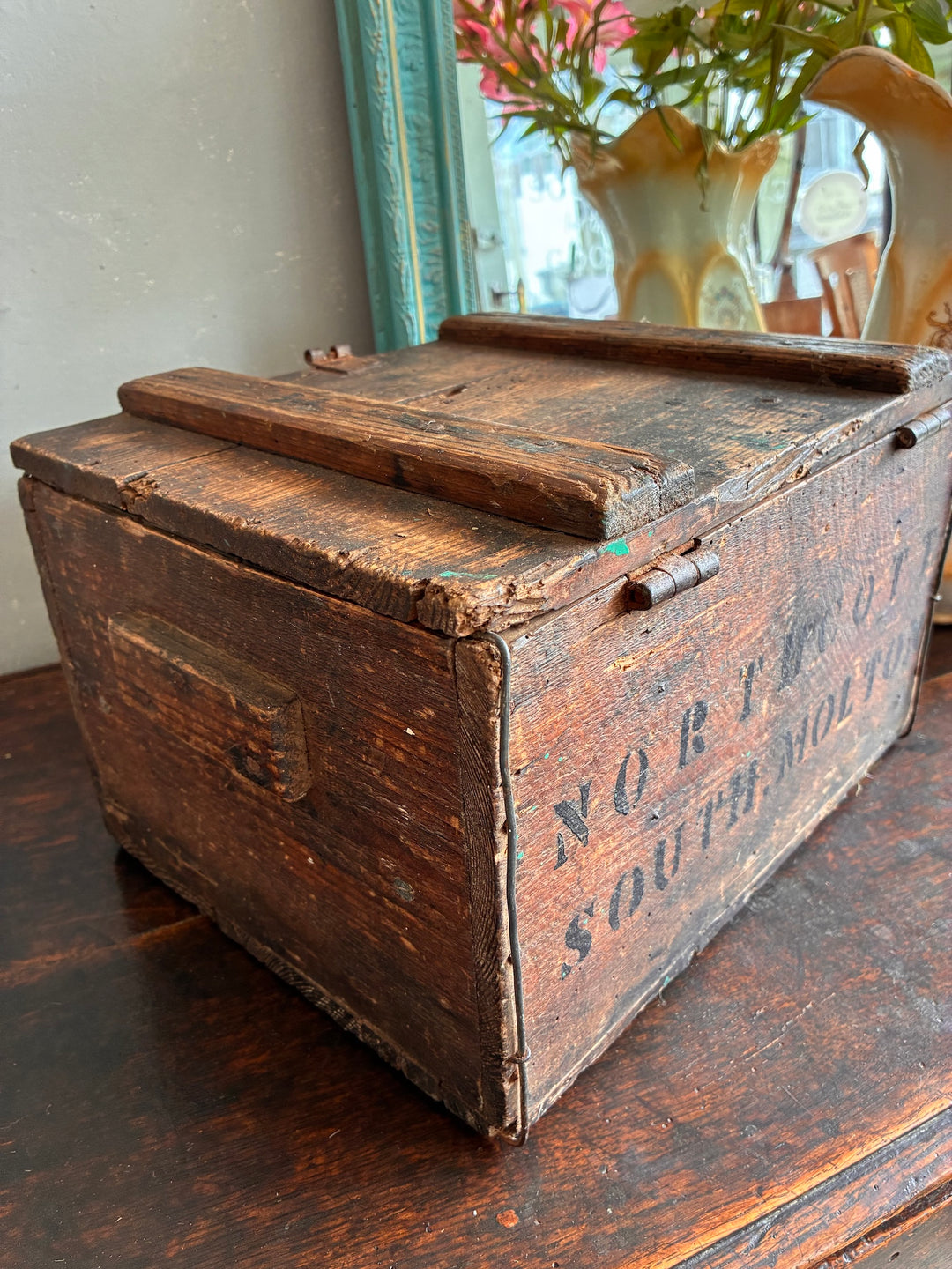 Rustic wooden box with hinged lid, featuring 'Northcott' and 'South Molton' stenciled, from Source for the Goose, Devon.