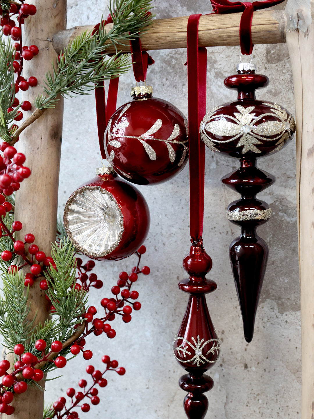 a selection of red glass christmas ornaments