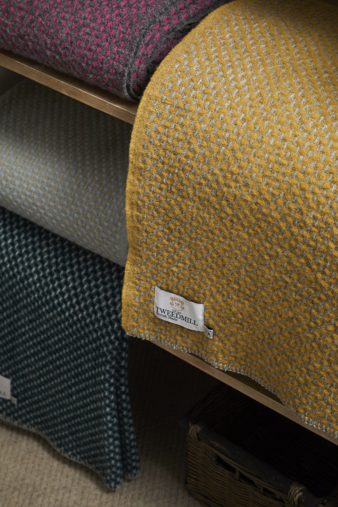 Tweedmill Twill Silver Grey and Mustard Throw showcasing warm mustard and grey hues, adding sophistication to living spaces.