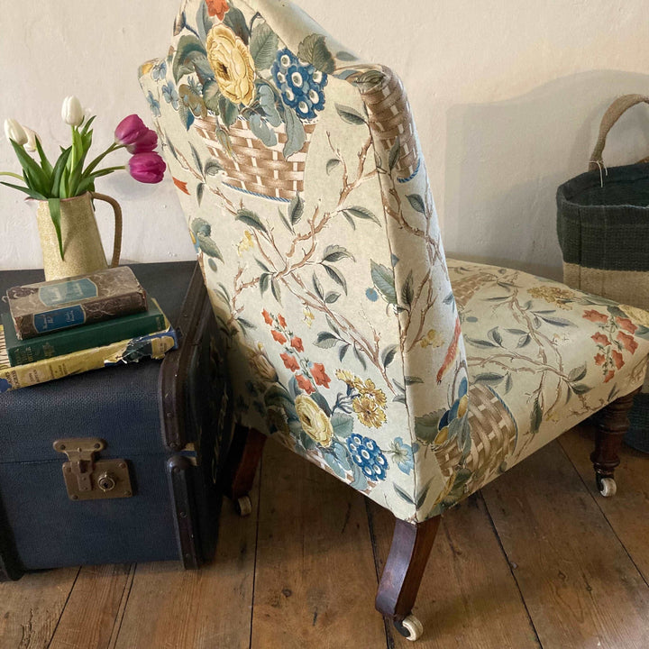rear view of low nursing chair in vintage fabric