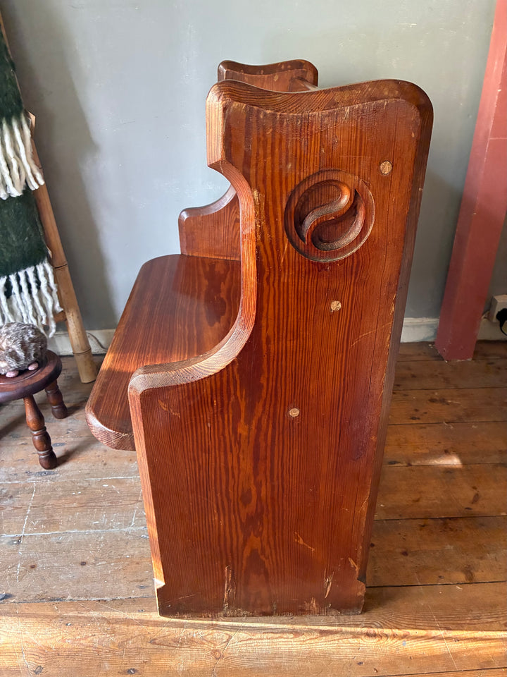 Side view of Small Antique Pine Church Pew with Victorian gothic carvings, sourced from Source for the Goose, Devon.