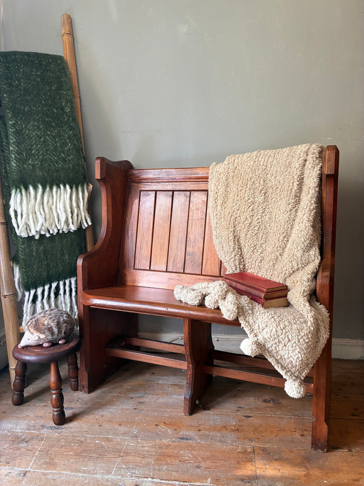 Small Antique Pine Church Pew with cozy blanket and book, perfect for rustic home decor from Source for the Goose, Devon.