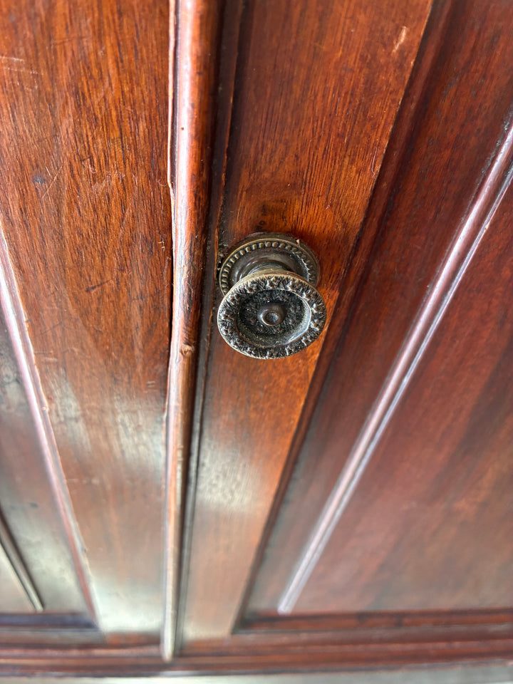 Small Edwardian Walnut Cabinet door handle detail showcasing vintage design and craftsmanship.