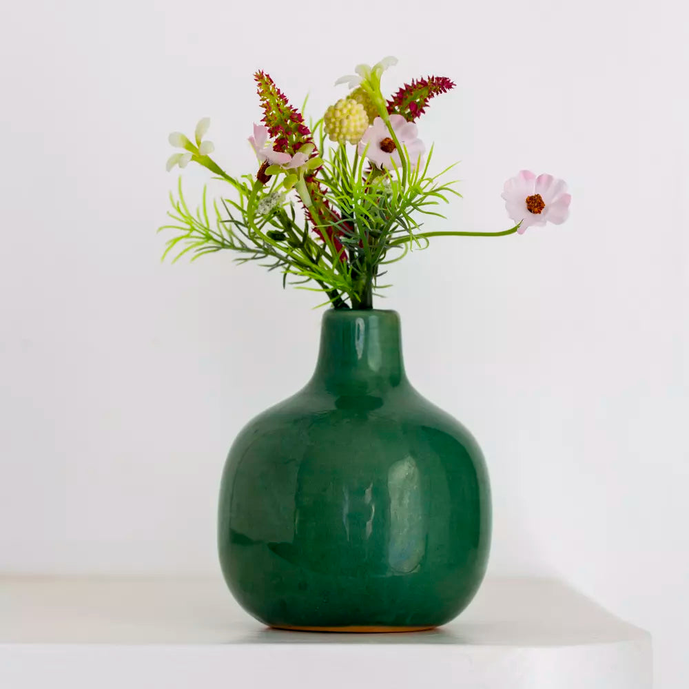 Dainty ceramic bud vase in vibrant green with flowers, charming home decor from Source for the Goose, Devon.
