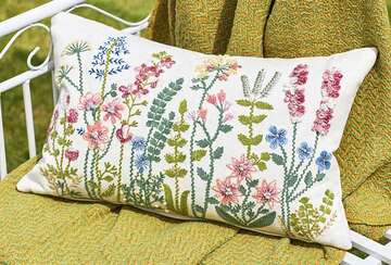 Rectangular Summertime Flower Cushion with vibrant embroidery on a green background by Source for the Goose, Devon.