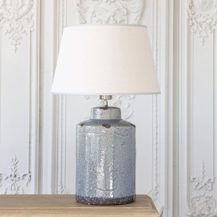 Tall blue crackle glaze stoneware table lamp with linen shade, perfect for home decor by Source for the Goose, Devon.