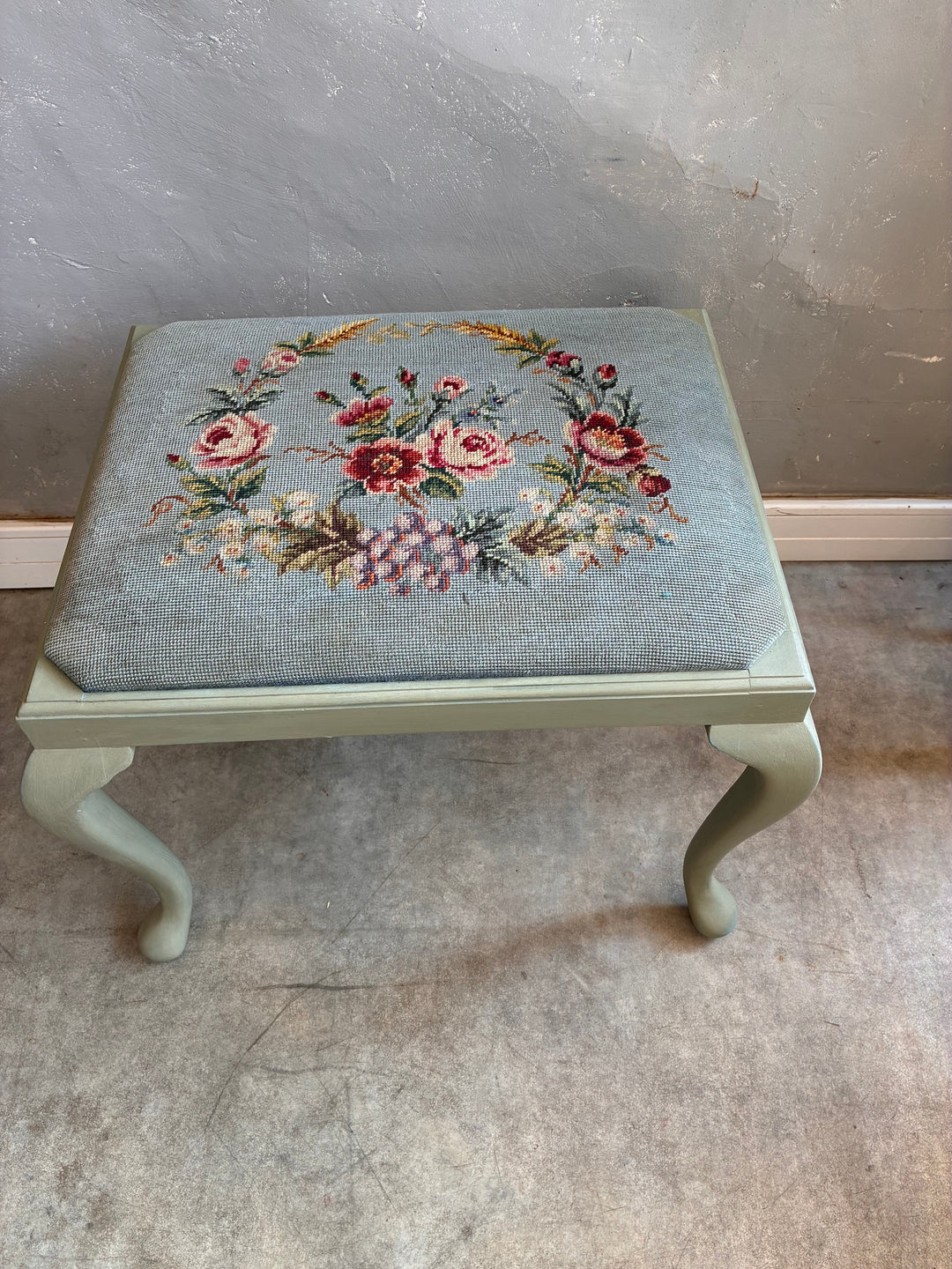 Vintage Stool with Floral Cushion featuring sage green cabriole legs and handcrafted floral needlepoint cushion.