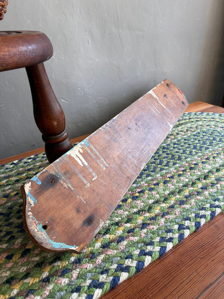 Vintage French wooden towel holder showcasing rustic charm, perfect for country-style kitchens and bathrooms.