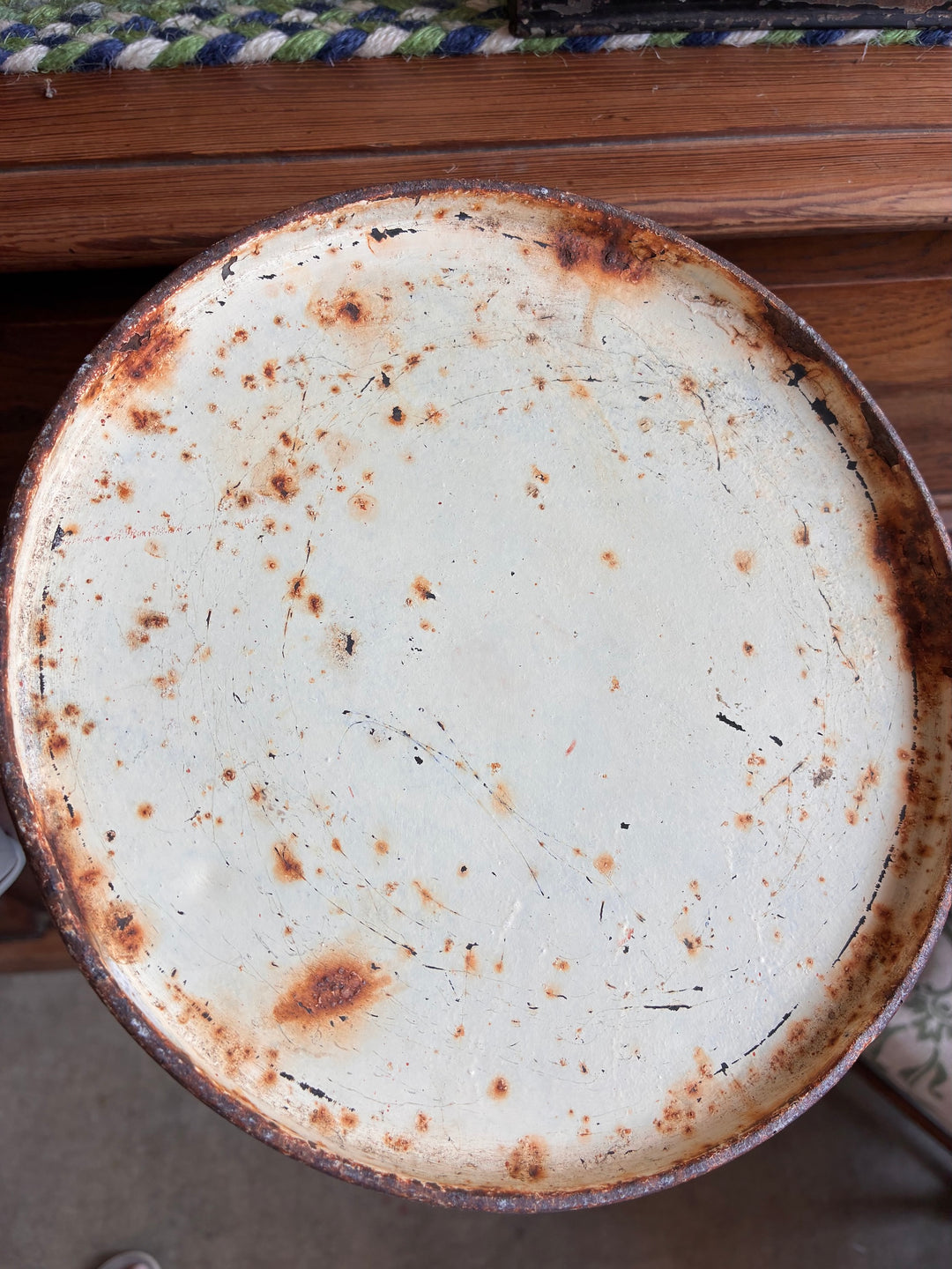Rustic vintage enamel tray with a distressed surface, perfect for farmhouse decor.