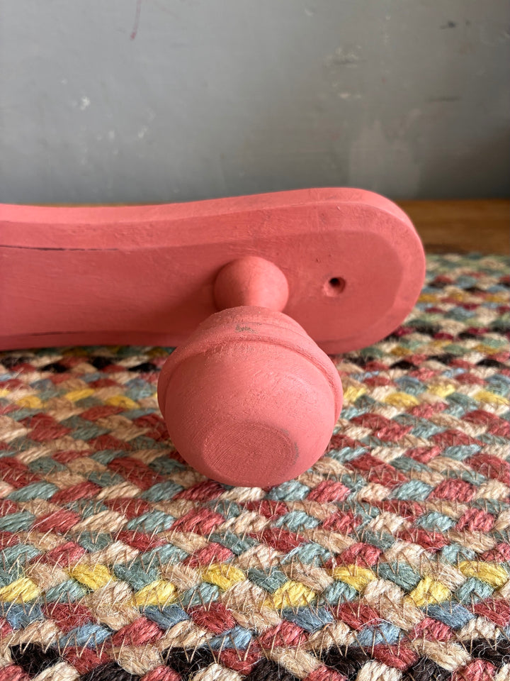 Earthy Pink Vintage French Coat Hooks close-up showing soft salmon pink finish and distressed details.