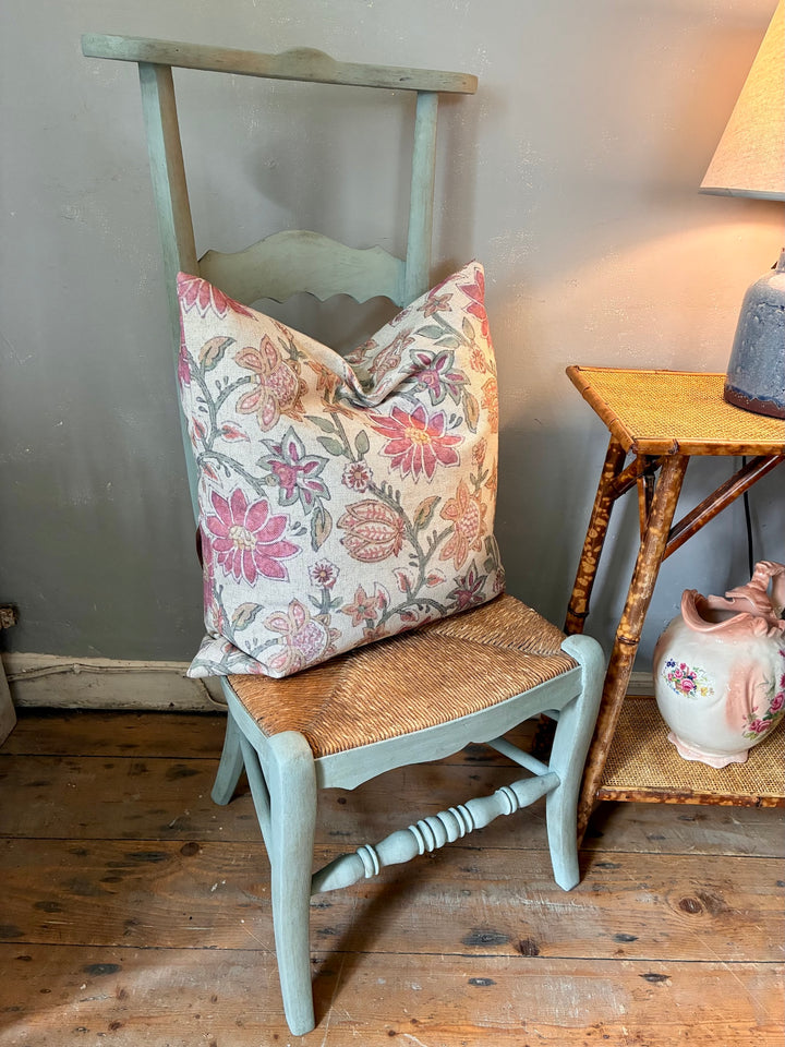 French Vintage Painted Prayer Chair - Prie Dieu with a decorative floral pillow and rush seat, showcasing timeless charm.