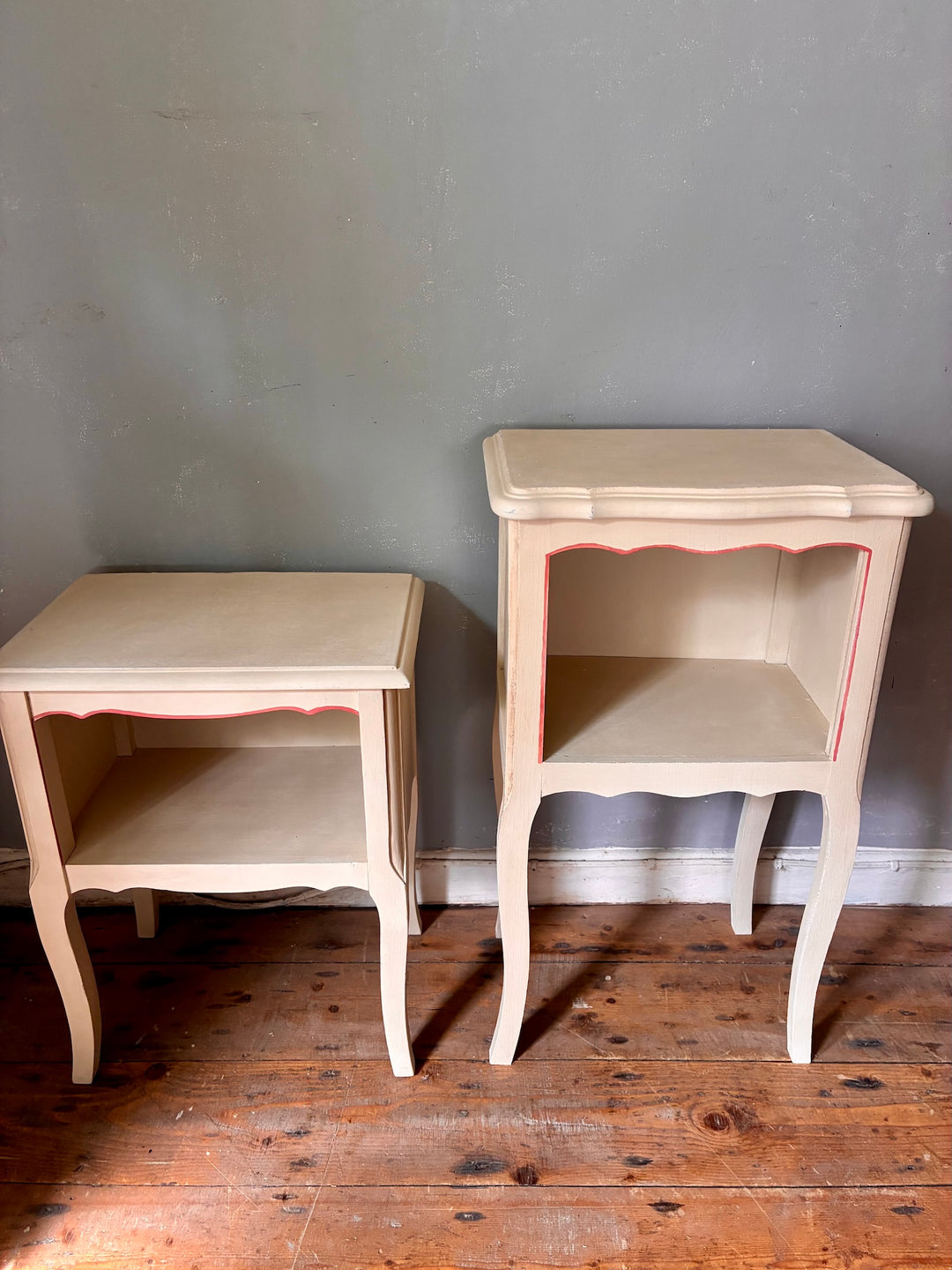 Vintage Painted French Bedside Tables - His and Hers displayed on wooden floor, showcasing elegant design and soft colors.