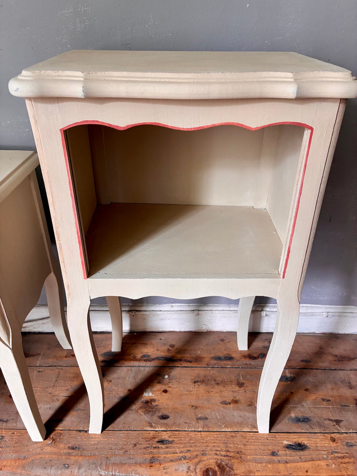 Vintage Painted French Bedside Tables - His and Hers with open shelf and fluted legs in soft ochre and coral pink accents.