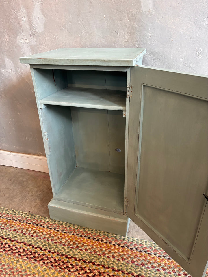 Vintage painted pot cupboard in duck egg blue with an open door, showcasing a single shelf, perfect for bedside storage.