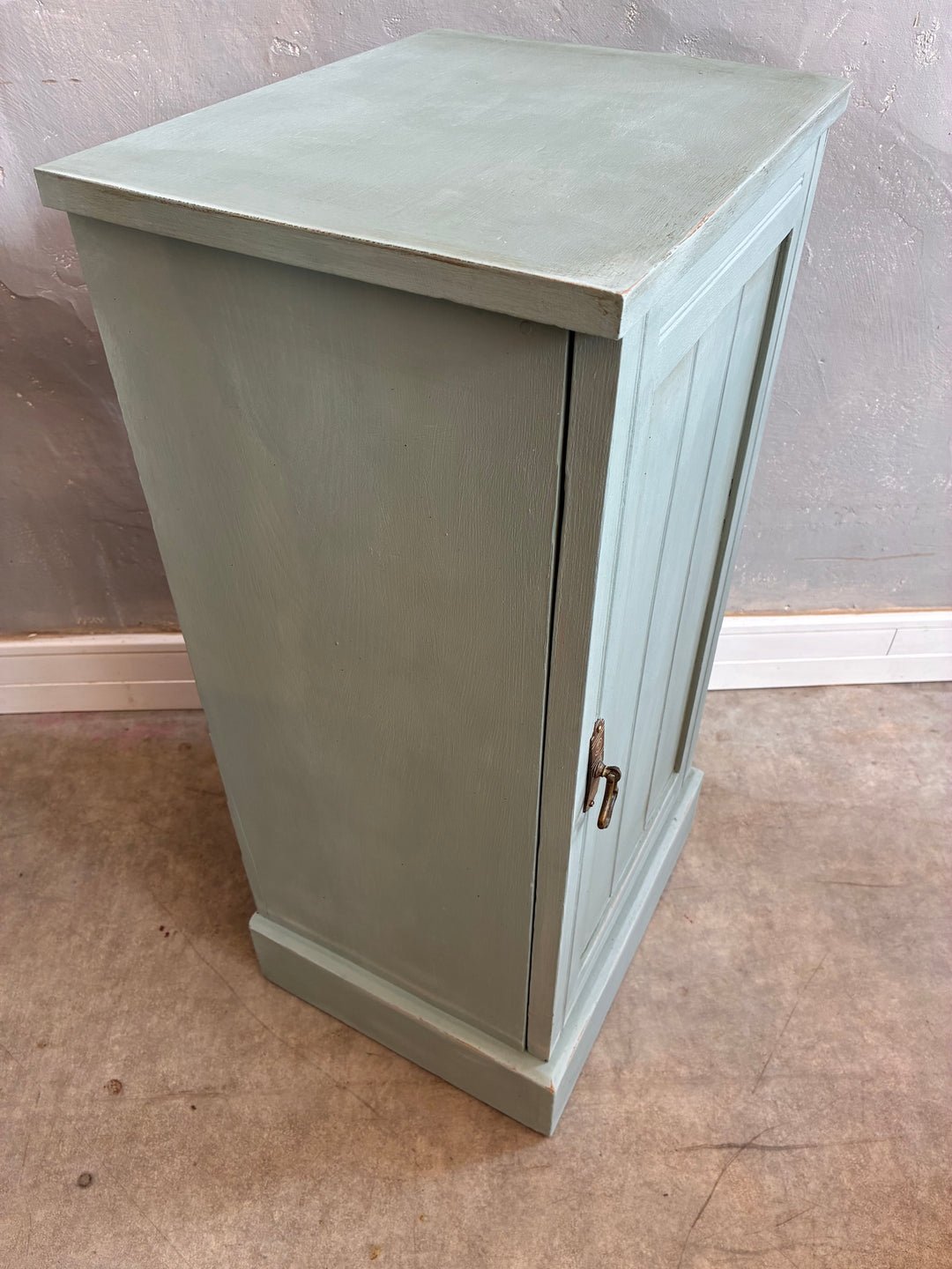 Vintage painted pot cupboard in duck egg blue with a subtle aged finish and brass handle, ideal for bedside storage.